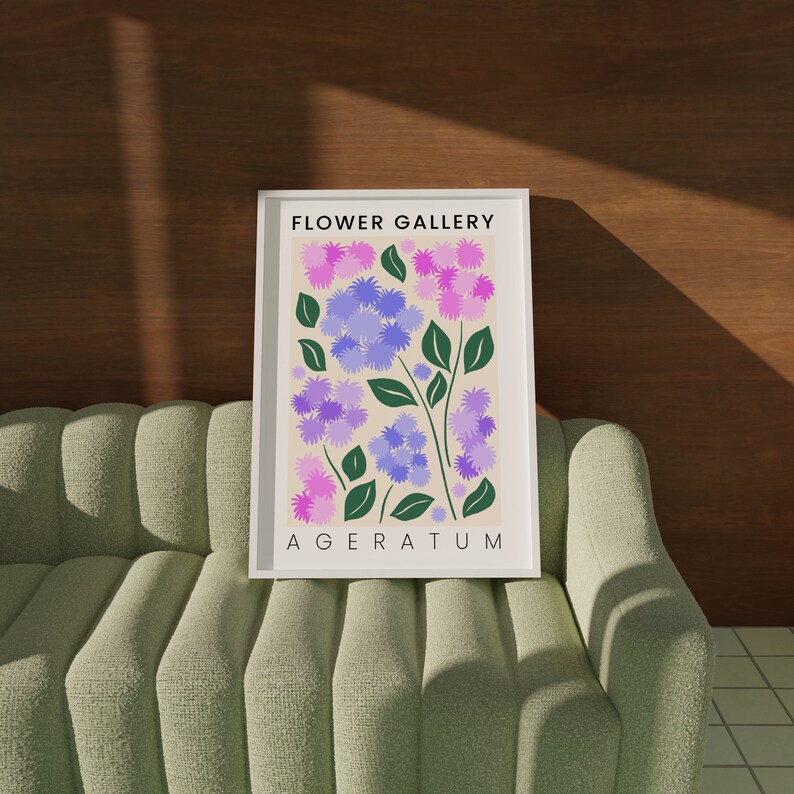 May include: A framed print with a botanical illustration of purple and pink flowers with green leaves. The print is titled "FLOWER GALLERY AGERATUM".