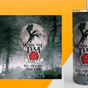 May include: A black and white image of a dragon flying in front of a full moon. The text "When the DM Smiles It's Already Too Late" is below the dragon. A red 20-sided die is in the centre of the text.