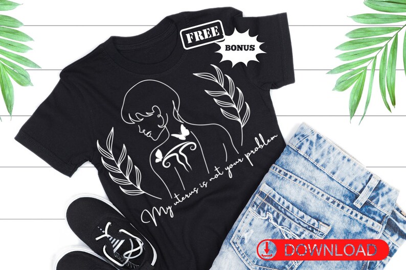 May include: Black t-shirt with a white line drawing of a woman with a butterfly on her back and the text "My uterus is not your problem".