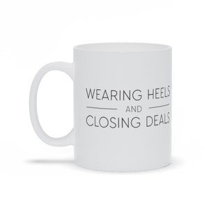 Wearing Heels And Closing Deals Mug - Muggsyco