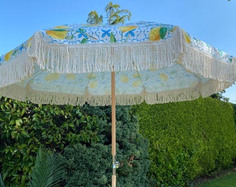 lemon print patio umbrella the LIMONE Beach 32 wide when open 23.5 tall (top to handle bottom) Bamboo and synthetic silk Handmade in China Not for use in rain Our Beach Umbrella Patio Umbrella