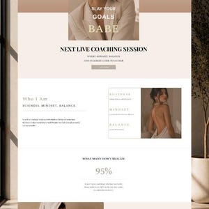May include: Website design with a neutral color palette, featuring text that reads "SLAY YOUR GOALS BABE" and "NEXT LIVE COACHING SESSION." The site promotes business, mindset, and balance. A woman is shown in a white robe.