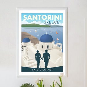 May include: A travel poster featuring a couple silhouetted in front of a white building with blue domes in Santorini, Greece. The poster has the text "Santorini Greece" and "Kate & Schmidt" at the bottom.