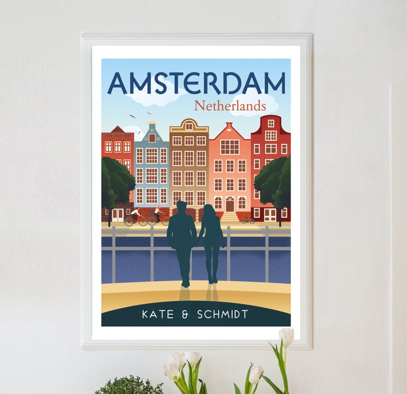 May include: A colorful illustration of Amsterdam, Netherlands, with a couple walking hand-in-hand in front of traditional canal houses. The text "AMSTERDAM" and "Netherlands" is at the top of the image. The text "KATE & SCHMIDT" is at the bottom of the image.