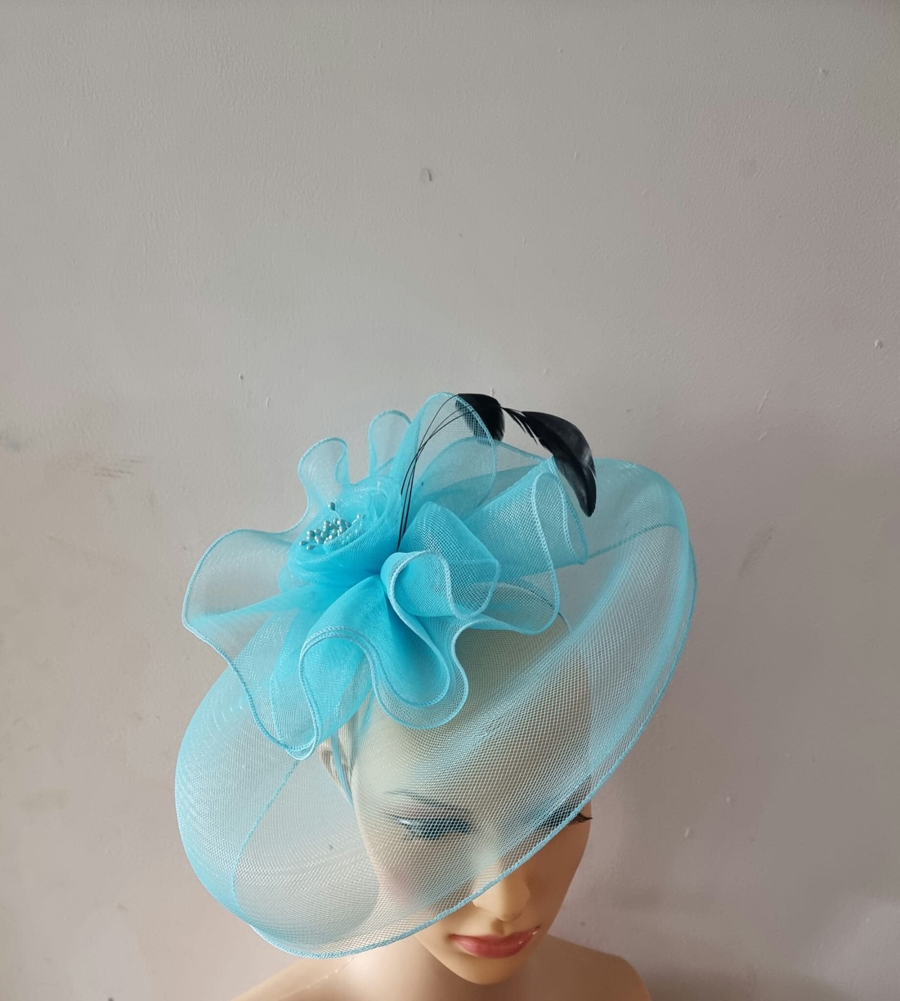 Turquoise Blue fascinator With Flower 