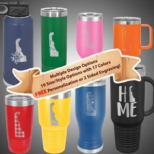 May include: Assortment of stainless steel tumblers in various colors and sizes, featuring engraved designs of the state of Delaware. Some tumblers have a handle. The text "Multiple Design Options", "19 Size/Style Options with 17 Colors", "FREE Personalization or 2 Sided Engraving!" and "H ME" is visible on the image.