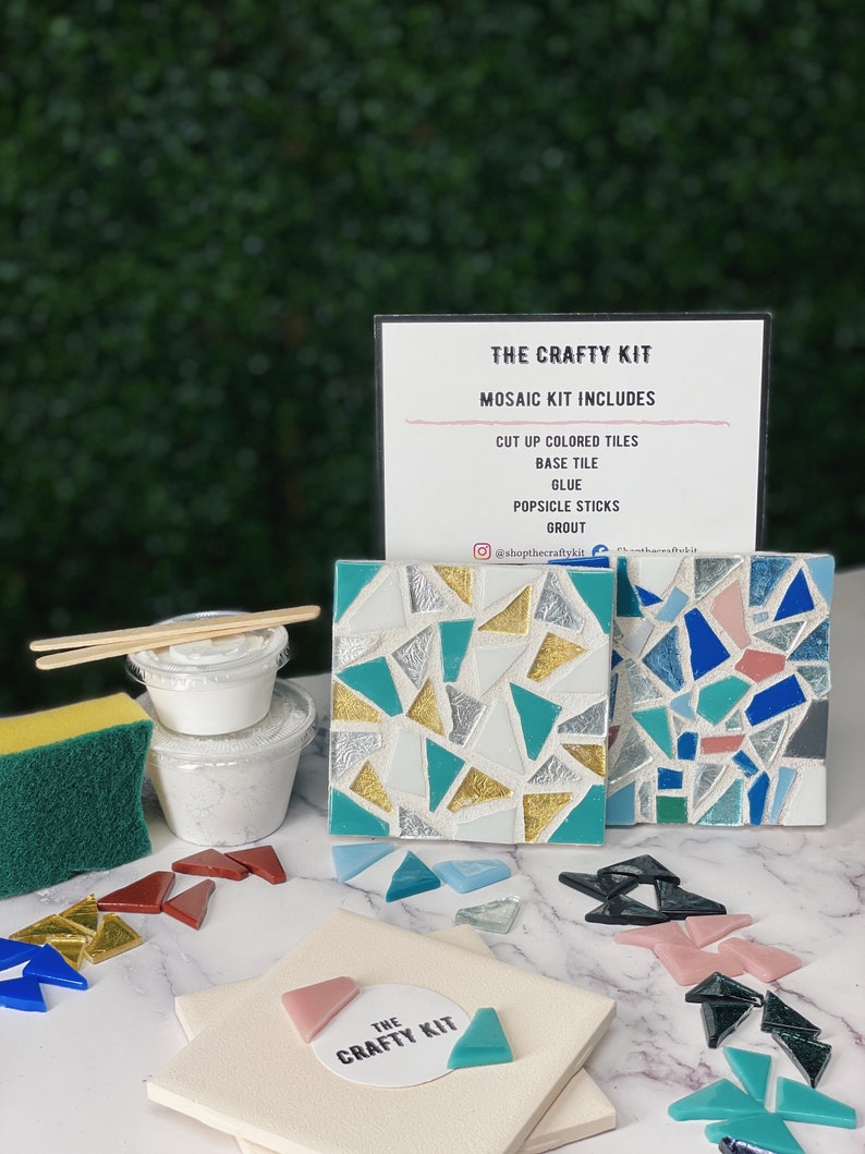 May include: A mosaic craft kit with all the supplies needed to create a mosaic art project. The kit includes a base tile, cut up colored tiles, glue, popsicle sticks, and grout. The kit is displayed on a white surface with a green background.
