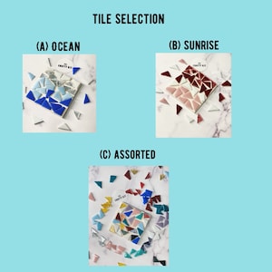 May include: Three different tile selections for mosaic crafts. The first selection is called "Ocean" and features blue, white, and silver tiles. The second selection is called "Sunrise" and features red, white, and pink tiles. The third selection is called "Assorted" and features a variety of colors including red, blue, green, yellow, pink, and white.