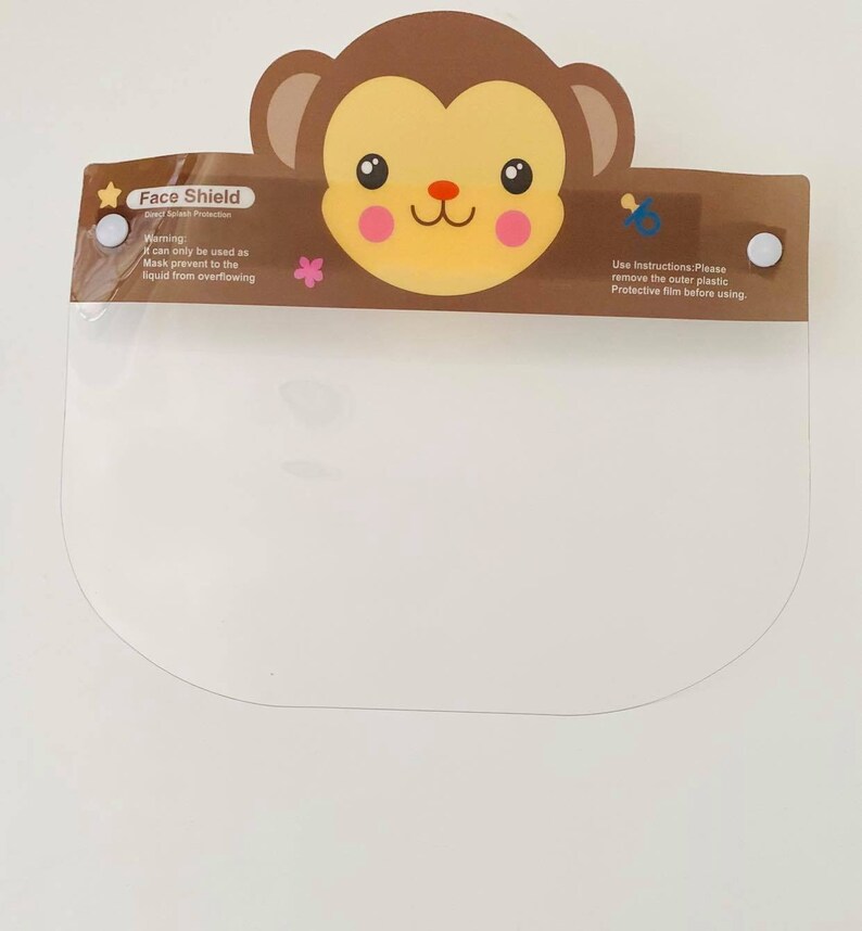 May include: A clear plastic face shield with a brown monkey design. The shield has a warning label that says "Warning: can only be used as Mask prevent to the liquid from overflowing." The shield also has instructions that say "Use Instructions: Please remove the outer plastic Protective film before using."