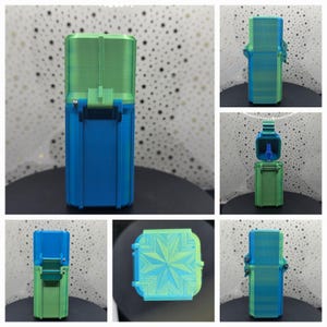May include: A small, two-piece, blue and green container with a geometric pattern on the lid. The container is closed in the first image, open in the second, and shown from different angles in the remaining images.