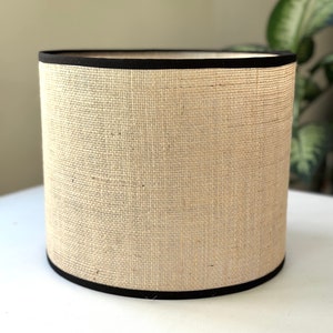 Natural hessian jute handmade drum lampshade with black trim.  Suitable for table, standard or ceiling 20 25 30 35 40 cm wide, any height.