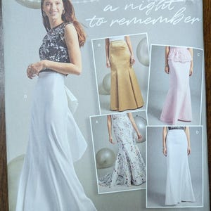 May include: Simplicity sewing pattern featuring evening gowns. The pattern includes a variety of styles, including a white skirt with a bow detail, a gold skirt, a pink skirt, and a floral print skirt. The text "a night to remember" is visible.