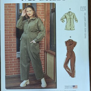 May include: McCall's sewing pattern M8243 featuring a jumpsuit design. The pattern includes multiple view options and simple instructions. The image shows a woman wearing a green jumpsuit. Size KK (26W-28W-30W-32W). Designed and printed in USA.