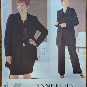 May include: A Vogue American Designer sewing pattern envelope for Anne Klein featuring a black blazer, a matching skirt, and trousers. The cover displays two views of the suit in sizes 14W to 30W, with the text 2282, Anne Klein, and Vogue American Designer.