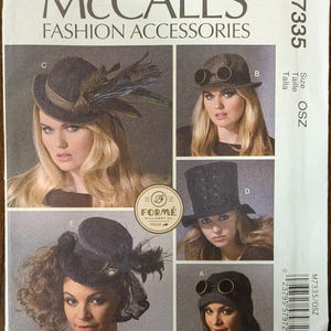 May include: A McCall's Fashion Accessories sewing pattern, M7335, featuring various hat designs. The hats include a fedora with feathers, a hat with goggles, a top hat, and a hat with a veil. The pattern includes the size OSZ.