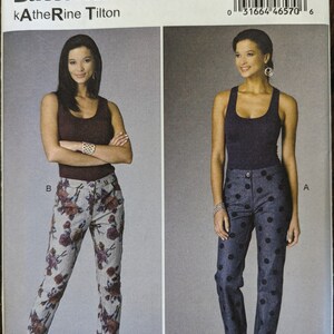 May include: A sewing pattern for women's pants. The pattern includes two different styles of pants: one with a floral print and one with polka dots. The pattern is for sizes 8-10-12-14-16. The pattern number is B6327/B5.