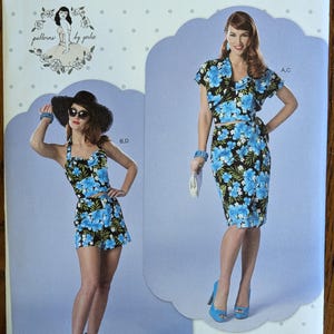 May include: Simplicity sewing pattern S9290 for a two-piece outfit featuring a blue and black floral print. The pattern includes options for a halter top with shorts or a short-sleeved top with a wrap skirt. The envelope displays size U.S. 6-14.