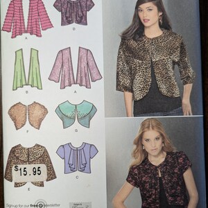 May include: A sewing pattern for a women's top with a variety of styles. The pattern includes a ruffled top, a cardigan, a jacket, and a blouse. The pattern is for sizes 6, 8, 10, 12, and 14. The pattern is designed by Karen Z. and is available for $15.95.