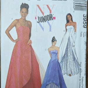 May include: McCall's NY Junior pattern featuring three formal gowns. The gowns are strapless, with flowing skirts in shades of pink, white, and blue. The pattern number is 3959, with sizes 11/12-17/18.