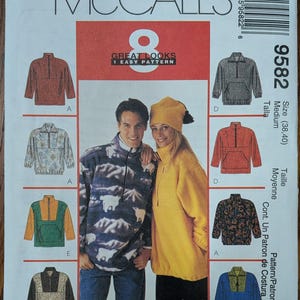 May include: McCall's 9582 sewing pattern envelope for a pullover with a quarter-zip neckline and long sleeves. The front features illustrations of various color-blocked and patterned fleece tops, including a polar bear print and a solid yellow version.