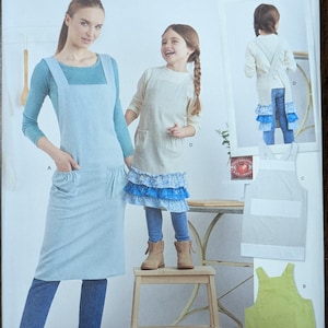 Uncut Simplicity Sewing Pattern #S9436 for Adults and Children&#39;s Aprons. Sizes XS-L/XS-XL