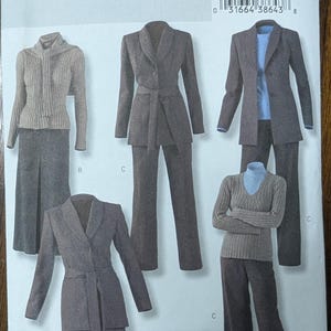 May include: A sewing pattern for a women's suit, jacket, and pants. The pattern is from Butterick and is size 8-10-12-14. The pattern includes a brown jacket with a belt, a brown skirt, and brown pants.