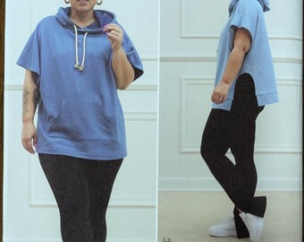 May include: Simplicity sewing pattern S9636 featuring a blue hooded top and black leggings. The pattern includes sizes U.S. 12-20. The image shows a woman modeling the outfit. The pattern is part of the DIY & Lifestyle brand.