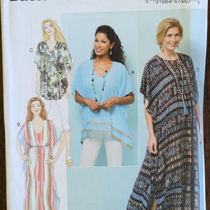 May include: Butterick B6559 sewing pattern featuring illustrations of various caftans and tunics. The pattern includes designs for a striped caftan, a blue tunic, and a patterned maxi dress. The pattern size is (Xsm-Sml-Med).