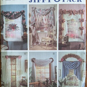 May include: A Simplicity 7721 sewing pattern envelope titled Abbie's Jiffy 6 Pack. The front displays six distinct window treatment designs, including floral swags, lace curtains, and draped valances, each numbered one through six.