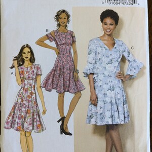 May include: A sewing pattern for a dress with three different styles. The pattern is for sizes 14-16-18-20-22. The pattern is from Butterick and the pattern number is B6514.