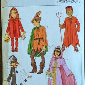 May include: Butterick BP427 sewing pattern for kids' costumes. The pattern includes designs for a Little Red Riding Hood, a Robin Hood, a devil, a princess, and a jester. The text "one HOUR fast & easy sewing" is also visible.