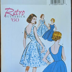 May include: Butterick sewing pattern B5748 for a 1960s style dress. The envelope features illustrations of two dress variations: one with a blue and white floral print and a back bow, and another in solid blue. Includes size range 14-22.