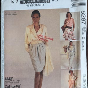 May include: A vintage sewing pattern envelope from McCall's, featuring a woman in a cream-colored blazer and gray skirt. The envelope includes images of different outfit options and the text "SEW NEWS" and "Cut-to-Fit".
