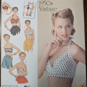May include: Simplicity sewing pattern number 1426, a vintage 1950s style pattern for a halter top. The pattern includes four different styles of tops, all with a halter neckline. The pattern is designed and printed in the USA.