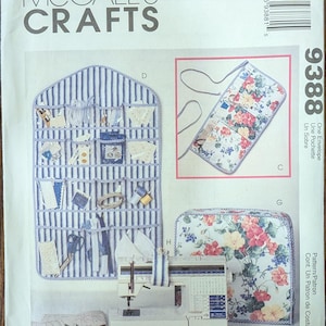 May include: A McCall's Crafts sewing pattern envelope. The pattern features a blue and white striped organizer, a floral print pouch, and a sewing machine. The text "MCCALL'S CRAFTS" and the number "9388" are visible.