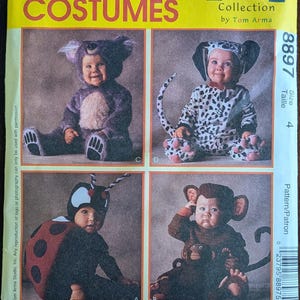 May include: McCall's Costumes pattern featuring four baby costumes: a koala, a Dalmatian, a ladybug, and a monkey. The costumes are shown on babies. The pattern number is 8897.