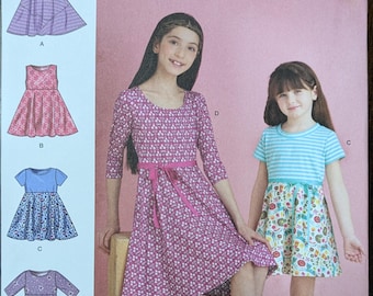 Uncut Simplicity Sewing Pattern #S9322 for Girls' Pull-Over Dresses with 4 Variations. Sizes 7-14.