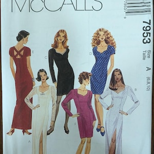 May include: McCall's sewing pattern featuring six dress designs. The pattern cover displays illustrations of the dresses, including a red dress with a crisscross back, a black long-sleeve dress, and a blue polka dot dress. The pattern number is 7953.