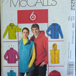 May include: McCall's sewing pattern M5252 featuring six jacket and vest designs. The pattern includes illustrations of a blue vest, a red hooded jacket, and a yellow vest. Size XM (Small-Medium-Large).