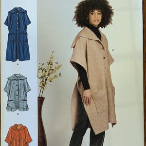 May include: Simplicity sewing pattern S9649 for a hooded cape with a button-front closure and two large patch pockets. The pattern includes three variations in length and color, with sizing ranging from S to XXL for U.S. standard measurements.