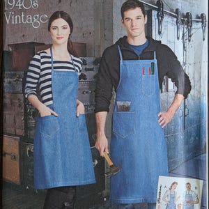 May include: Simplicity sewing pattern 8151 featuring denim aprons. The pattern is labeled "1940s Vintage" and includes sizes for U.S., Euro, and French measurements. The image shows two people wearing denim aprons with pockets.