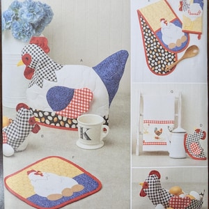 May include: A sewing pattern for a set of kitchen accessories featuring a chicken theme. The pattern includes a teapot cozy, a potholder, a dish towel, a hot pad, and a small chicken-shaped basket. The pattern is from Simplicity and is designed by Carla Reiss.