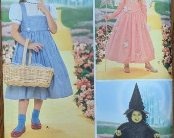 Uncut Simplicity Sewing Pattern 4139 for Kids' Wizard of Oz Costumes. Dorothy, Glinda and The Wicked Witch. Sizes 3-8.