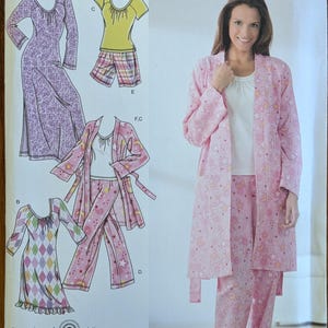 May include: A Simplicity sewing pattern envelope 3696 for sleepwear in sizes M, L, XL. The package displays illustrations of a long-sleeved nightgown, a short-sleeved top with shorts, and a robe with matching pants, plus a photo of a pink robe and pants.
