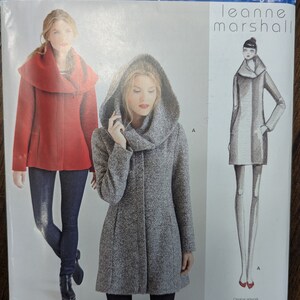May include: Simplicity sewing pattern S0468 for a hooded coat with a cowl neck. The pattern is designed by Leanne Marshall and includes sizes 4-12, 30-38, and 32-40.
