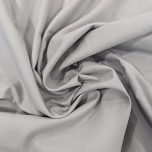 100% Cotton Fabric by the Yard. Solid Light Gray Fabric. 44&quot; Wide. Quilting Cotton Fabric. Apparel Weight Fabric.