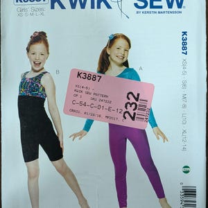 May include: Kwik Sew pattern K3887 for girls' sizes XS-XL. The cover features two girls modeling dancewear. One wears a black unitard, the other purple leggings and a blue top. The pattern includes sizes XS(4-5) to XL(12-14).