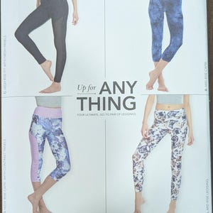 May include: A Simplicity sewing pattern for leggings, featuring four different styles: high rise with mesh panels, high rise capri with contrast panels, mid rise capri, and mid rise leggings. The pattern is designed and printed in the USA.
