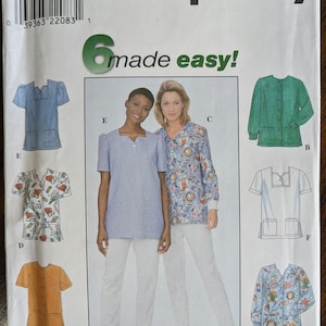 May include: Simplicity sewing pattern number 8351 for sizes 8, 10, and 12. The pattern includes six different styles of tops, including a solid blue top, a floral print top, a green top, a white top, a yellow top, and a patterned blue top. The pattern is titled "made easy!"