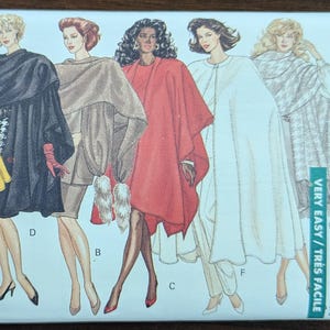 May include: Butterick Classics sewing pattern 6854 featuring illustrations of women's capes and coats. The pattern includes a variety of styles, from a yellow cape to a white coat. The text "Very Easy" is visible.